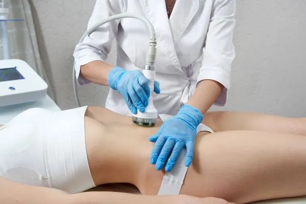 Lost the Weight but Not the Loose Skin? 2 woman having HIFU treatment on her stomach to combat loose skin Norfolk following weight loss